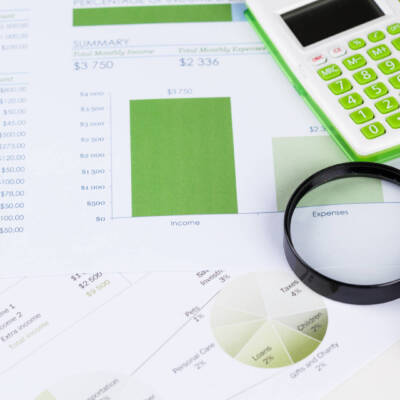 Calculator and magnifying glass on the table